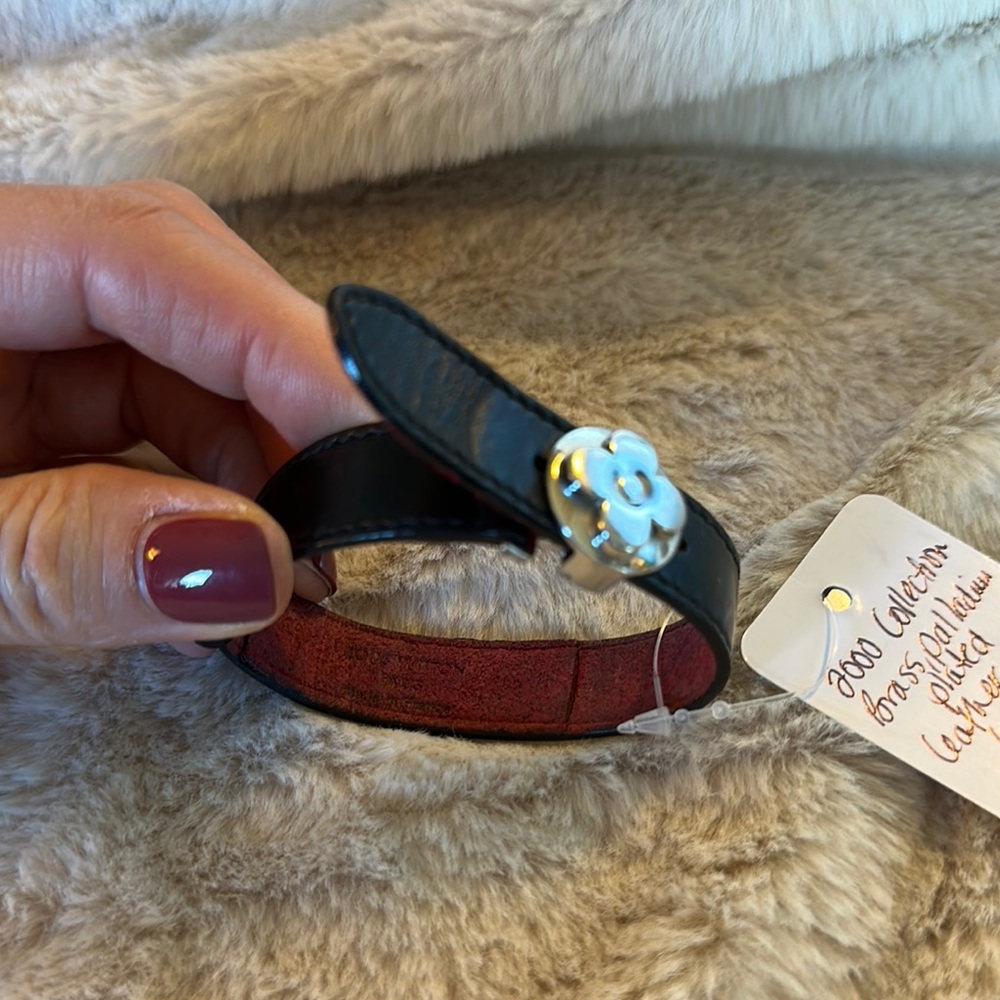 Louis Vuitton authentic Black Leather Bracelet with White Flower Accent, EUC